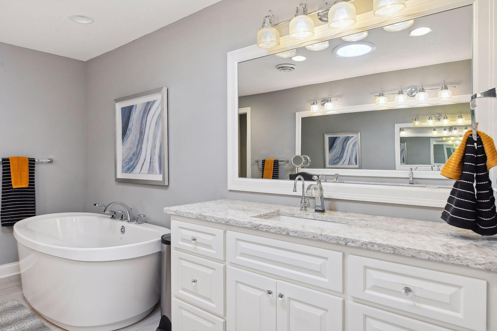 Primary ensuite with large soaking tub, cambria tile (w/heating system).