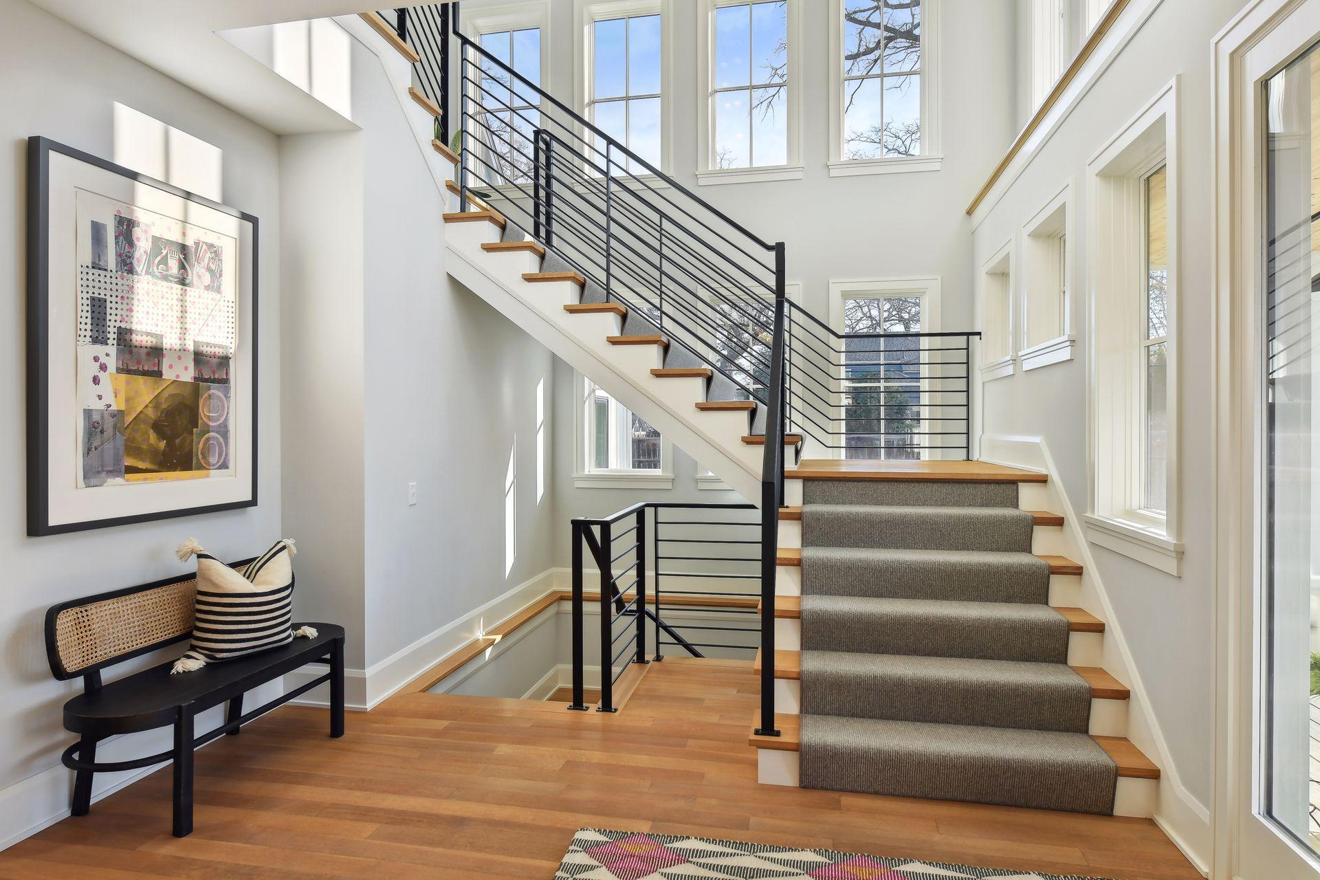 Wide custom-designed floating staircase with amazing bright light.