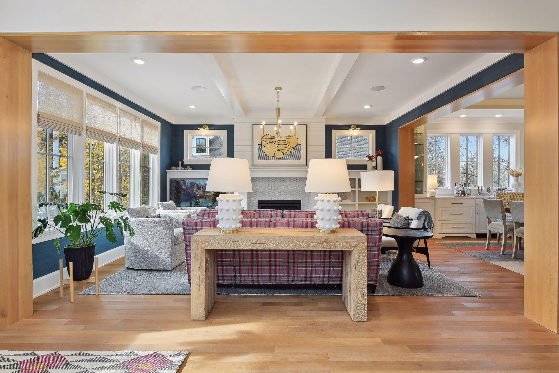 Living room with distinguished craftsmanship throughout. Oak casings accent the room with custom built-in cabinetry & media.