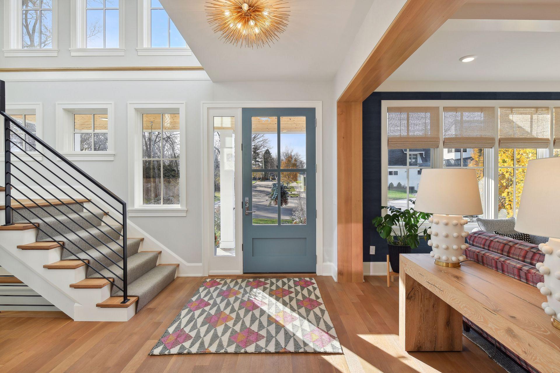 A sunny foyer with floor-to-ceiling windows brings in beautiful natural light throughout. Oak hardwood flooring (rift & quartered with a premium Rubio Monocoat finish) throughout the home.