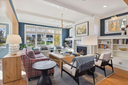 Ceiling detail includes custom beams. Grasscloth wallpaper sets the tone for a cozy space.