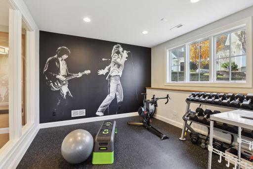 The lower-level exercise room has gym-grade flooring; yes, that is the Rolling Stones!