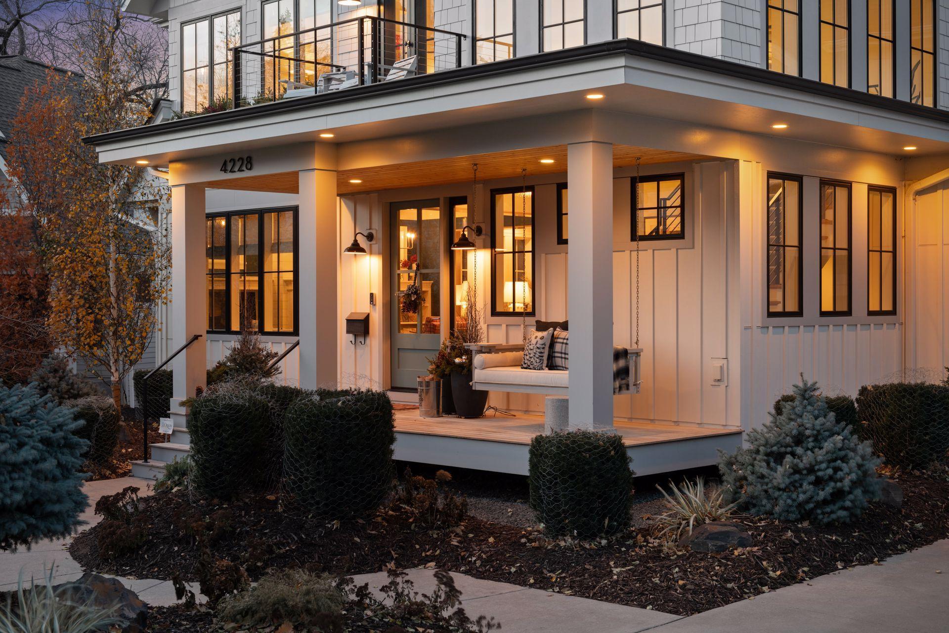 The spacious front porch & upper-level balcony are the perfect place to lounge or enjoy your morning coffee while engaging with neighbors.