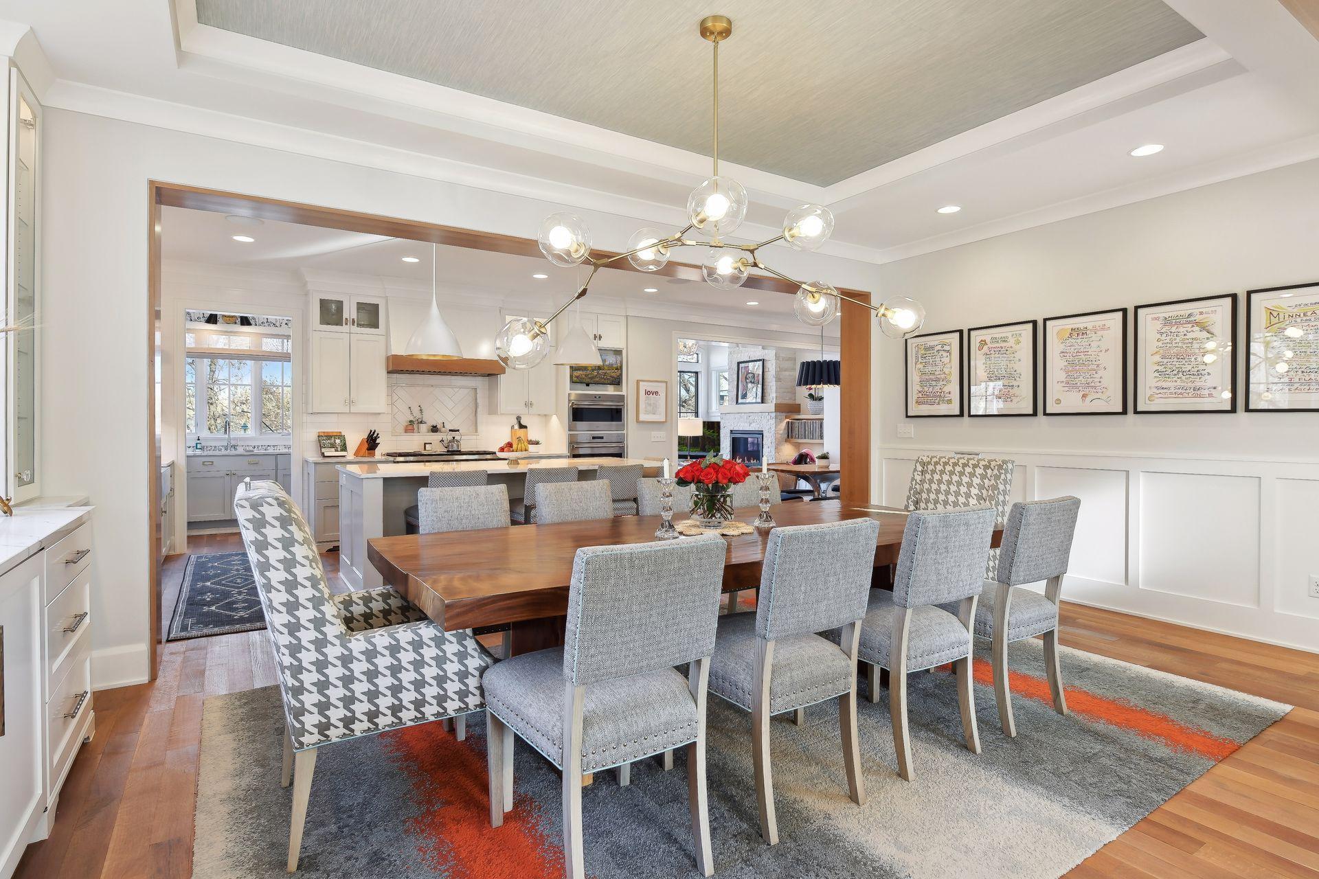 The dining room has a raised & coved ceiling, setting the room apart even within an open floor plan.