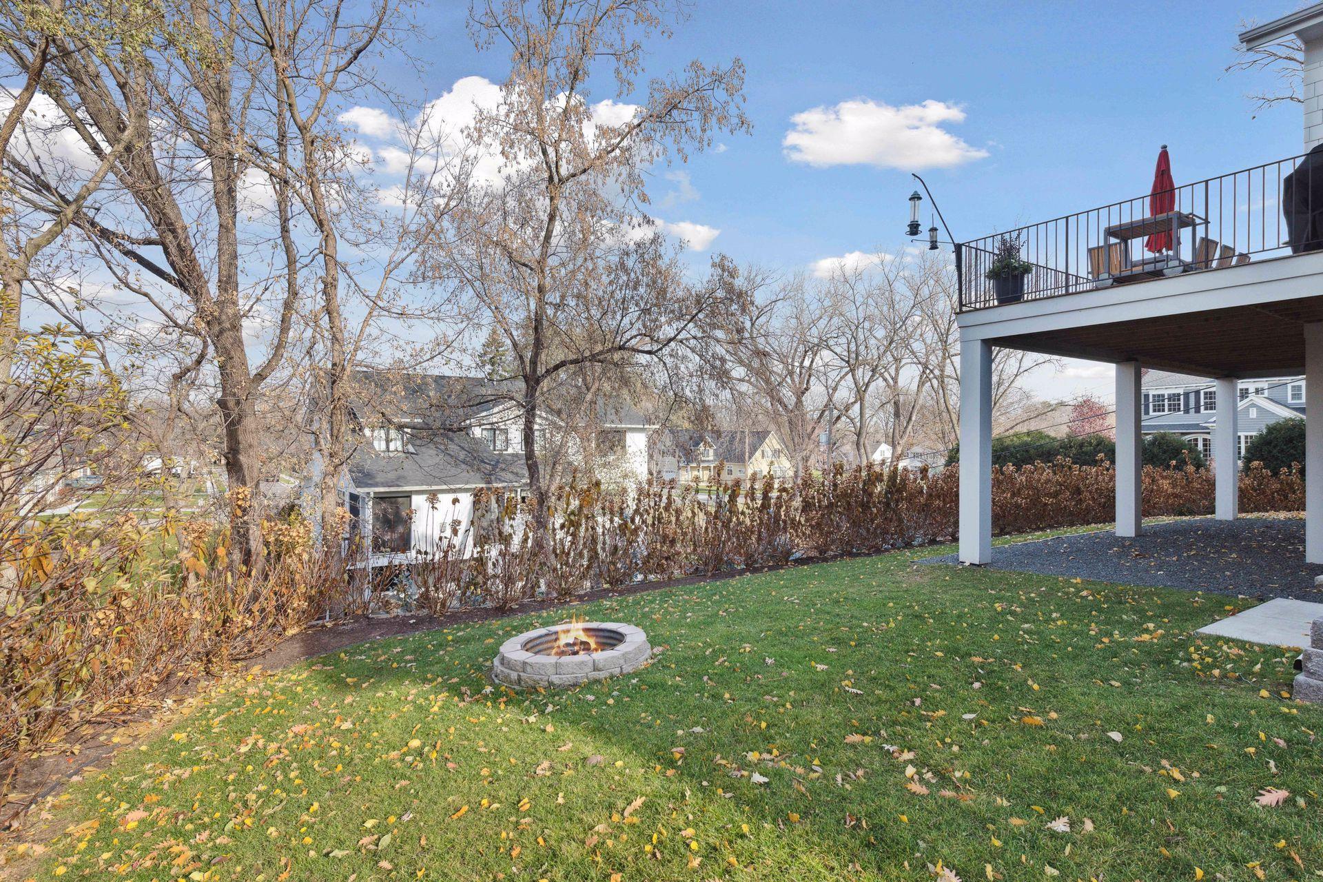 Gorgeous hydrangea bushes line the upper tier of the retaining wall. Just below is the bottom part of the backyard.