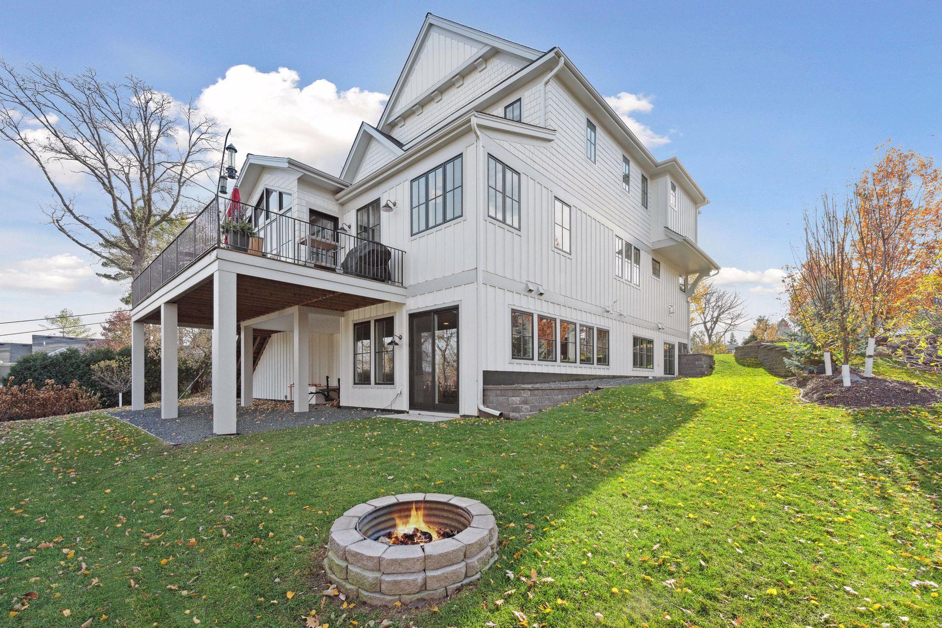 Spacious two-tier backyard with firepit. Potential for a 3 or 4-season porch under the deck.