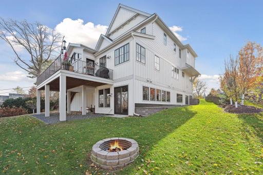 Spacious two-tier backyard with firepit. Potential for a 3 or 4-season porch under the deck.