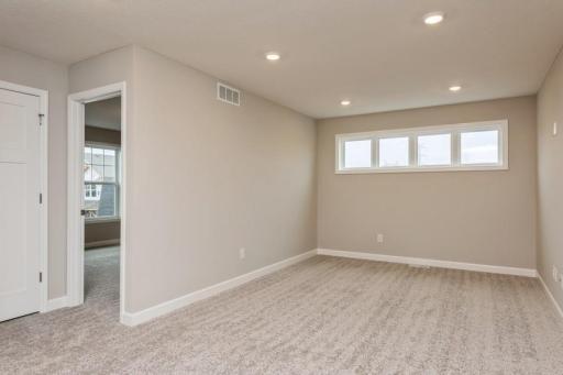 Loft located on the upper level, this perfectly sized living space has enough room for a desk, television and seating for all.