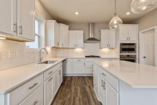 Enjoy plenty of seating at the kitchen island and dining area adjacent to the kitchen.