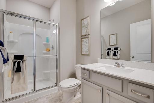 Complete with a bath, just steps from main level bedroom, it is just a perfect addition to the floor plan! Photo of model home, color and options will vary.