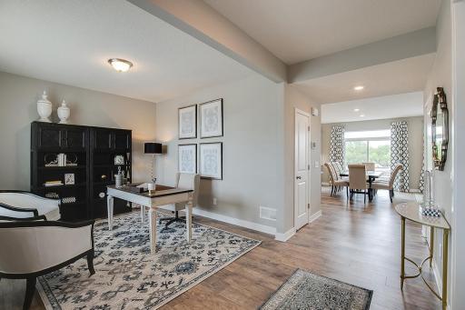 Speaking of flexible spaces - the home's front dining area is also loaded with uses. The perfect office setting, as well as a formal dining space, or just another sitting room. Your call!!! Photo of model home, color and options will vary.