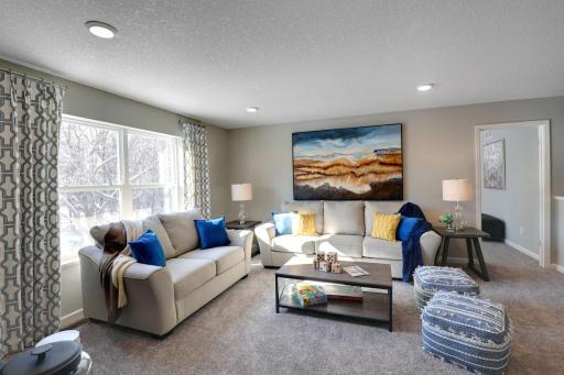 Relax, play and enjoy! This upper level game room provides an additional gathering space and is conveniently located adjacent to all four of the upper level bedrooms. Photo of model home, color and options will vary.