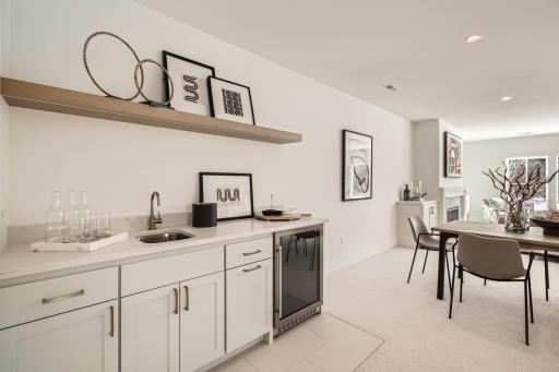 Lower level added wet bar in recreation room. Photos of model at 5655 Buffington.