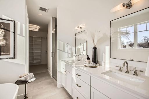 Primary bathroom ensuite. Photos of model at 5655 Buffington.