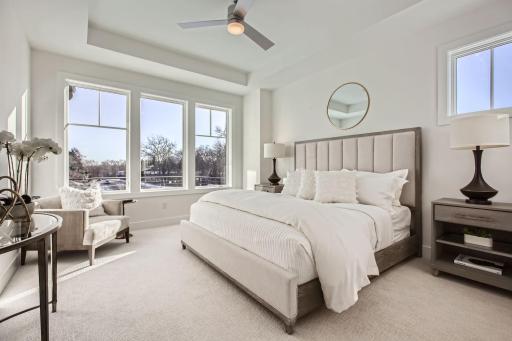 Main level executive primary suite. Photos of model at 5655 Buffington.