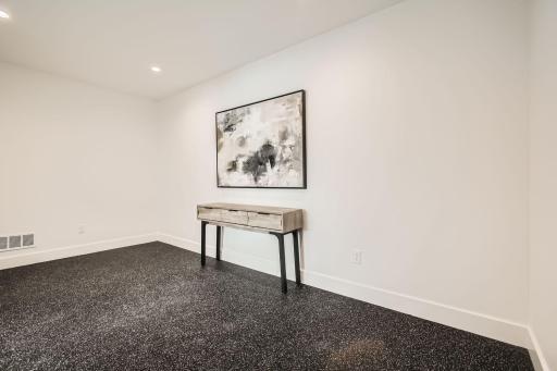 Lower level exercise room. Photos of model at 5655 Buffington.