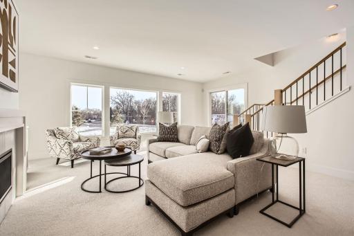 Lower level recreation room. Photos of model at 5655 Buffington.