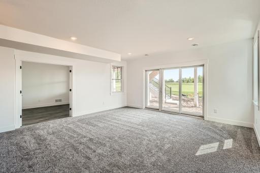 9' wide door in the lower level and ample windows! Beautiful!