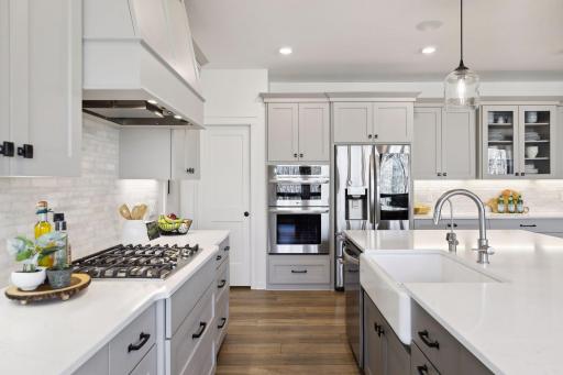 Commercial grade appliances and hood make this the ideal chef's kitchen.
