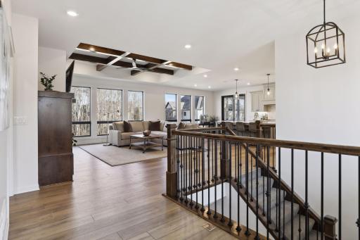 High ceilings with Box beam wood detail draw the eye to this exceptional space