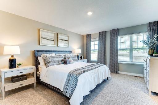 The homes primary bedroom is an oasis of its own! Complete with a private bath and oversized walk-in closet, it's the perfect setting to start and end each day in! (Photo of model, colors may vary)