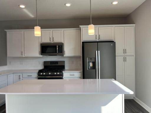 Open and naturally bright, the home's kitchen space is highly desirable.