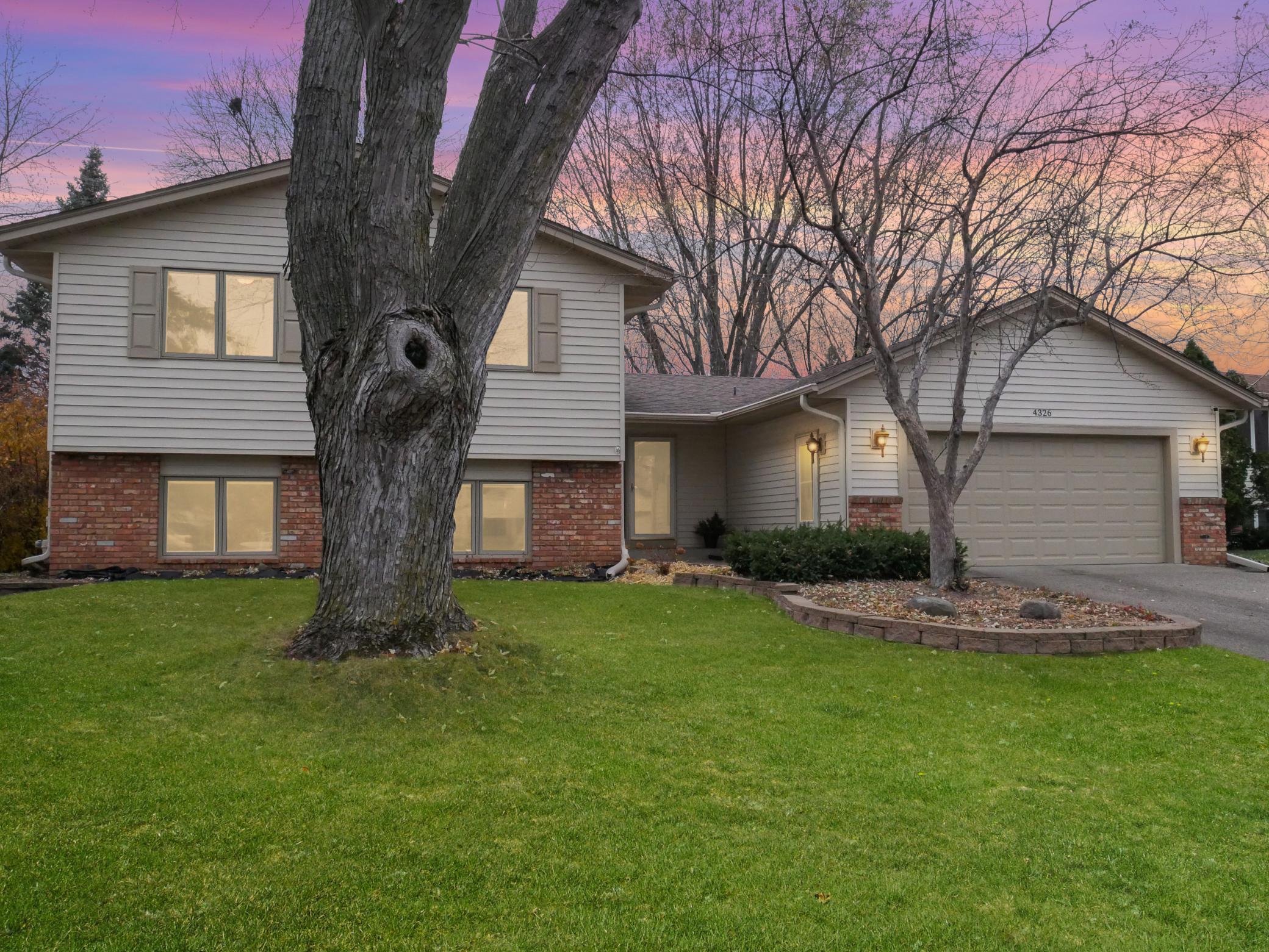 Welcome home to luxury living in Eagan, MN! This stunning 5-bed, 3-bath gem has three cozy fireplaces, a spacious backyard oasis with a hot tub, and a beautifully updated kitchen. Conveniently located near shopping, entertainment, dining and 35E.