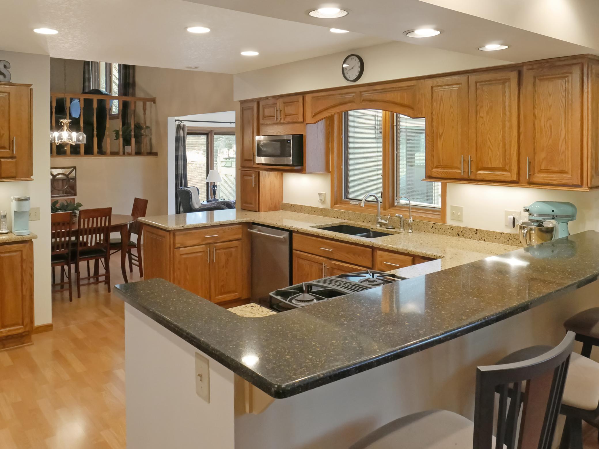 Kitchen offers loads of storage and working space for cooking or baking.