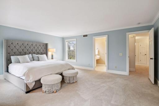 Very spacious primary suite includes ensuite full bathroom with two vanities.