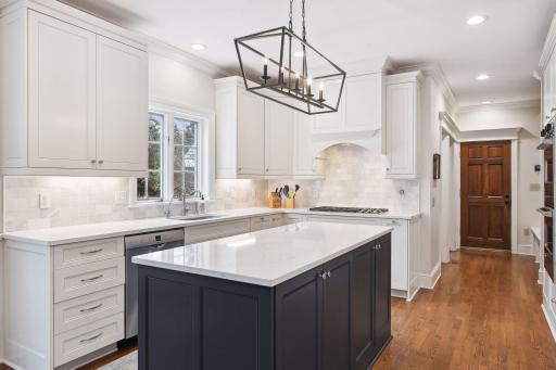 Gorgeous center-island kitchen was renovated in 2020 and features beautiful quartz countertops, Subzero refrigerator and freezer, Viking double wall ovens and Wolf 5-burner gas cooktop with overhead vent.