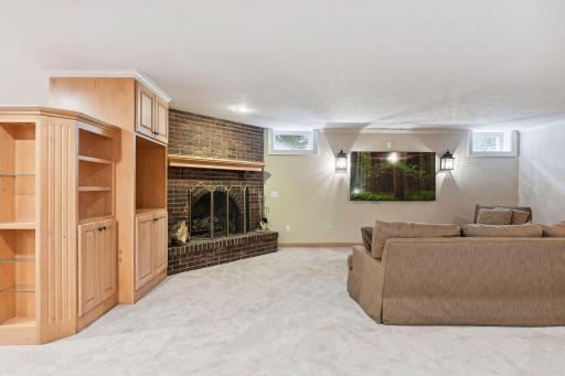 The large lower level is perfect for game day and casual entertaining. You'll love the cozy, woodburning fireplace!