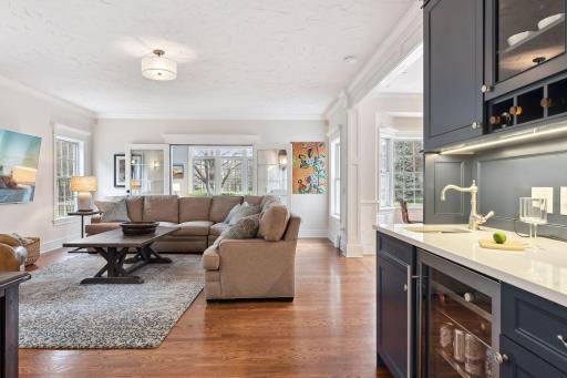 The spacious main-floor family room offers a charming wet-bar and abuts the center-island kitchen