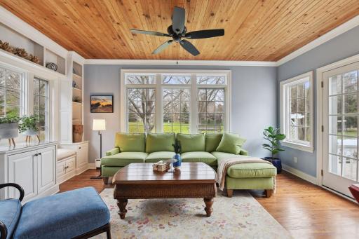 Enjoy beautiful views of the park-like grounds in the cozy sunroom with radiant, auxiliary heat.