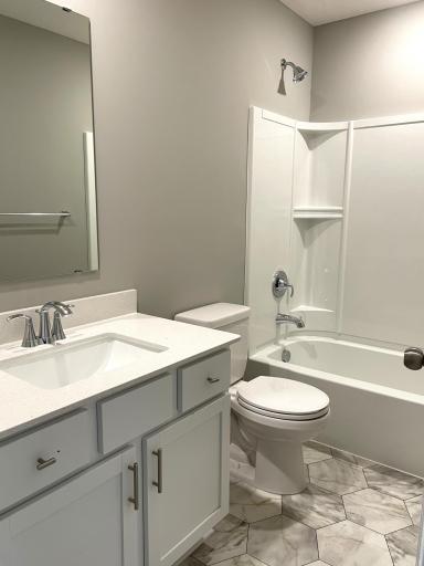 The home's secondary bath provides plenty of space for everyone to get ready during those busy mornings.
