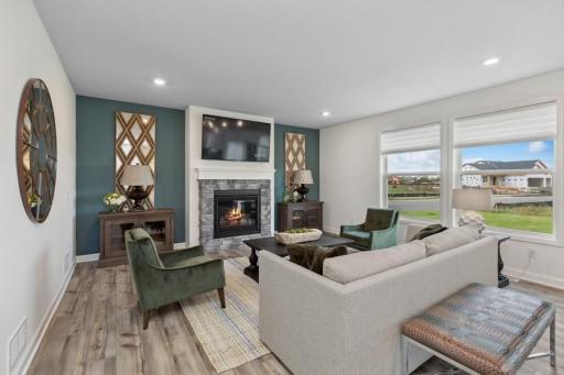 A cozy and contemporary living room! (Photo of decorated model, actual home's finishes may vary slightly)