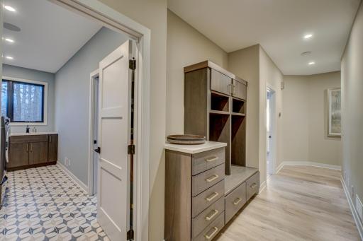 Enjoy the additional storage space this mudroom has to offer as well as the automatic senor lights