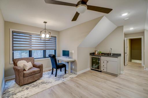 Guest suite above the garage with separate climate control, wet bar and beverage refrigerator, washer/dryer and a private bath