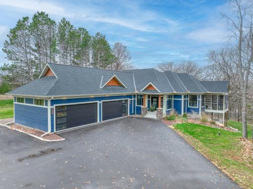 Heated 4 stall garage with a car charging outlet, plus additional open space on the lot to build a future outbuilding if you choose!