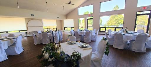 The ballroom located on the upper level set for a wedding