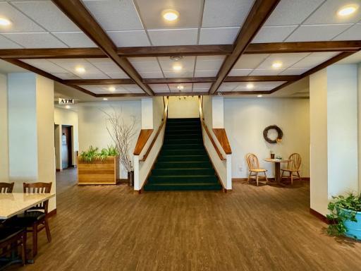 Stairs going up to the dining room, elevator is to the right