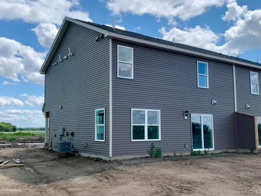 Pardon the mess, we're still under construction! Irrigation and sod are included. Views of Grass Lake right across the street! Photo of subject property.