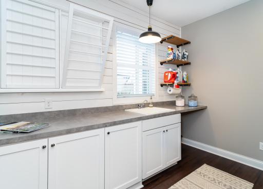Laundry Room Main Level with new Custom Cabinets and Shelving.