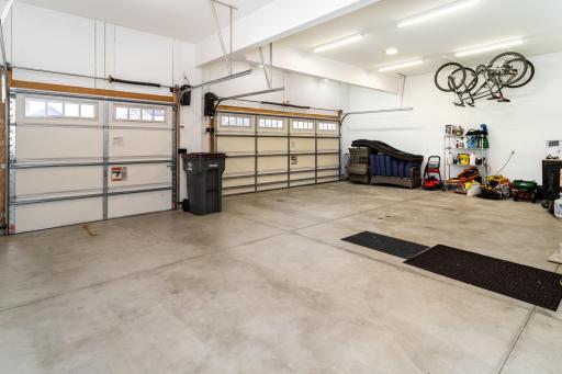 Heated 3 Stall Garage with Two New "Side Mount Lift Garage Opener's".