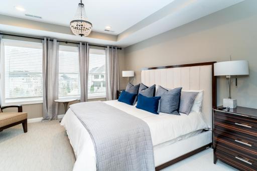 Spacious Upper Level Primary Bedroom - King Size bed, two nightstands, a long dresser and two chairs fit comfortably.