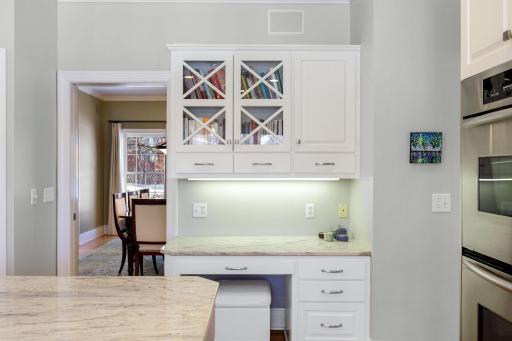 The kitchen has been beautifully remodeled featuring granite countertops, a tile backsplash, Viking gas cooktop, double oven, all stainless steel appliances, a toe-kick central vac feature and more.