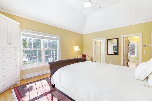 The spacious primary suite walks out to a private deck and has a recently updated, private bath featuring a walk-in shower, soaking tub, double vanities, laundry closet that fits full size stack-able units, and a large, walk-in closet.