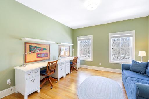 The fourth of four upper level bathrooms has access to a spacious attic storage room.