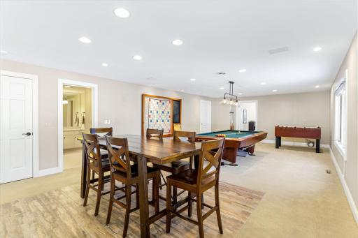 The spacious amusement room is great for entertaining and features a wet bar with a beverage fridge.