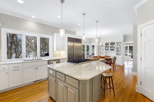 The kitchen has been beautifully remodeled featuring granite countertops, a tile backsplash, Viking gas cooktop, double oven, all stainless steel appliances, a toe-kick central vac feature and more.
