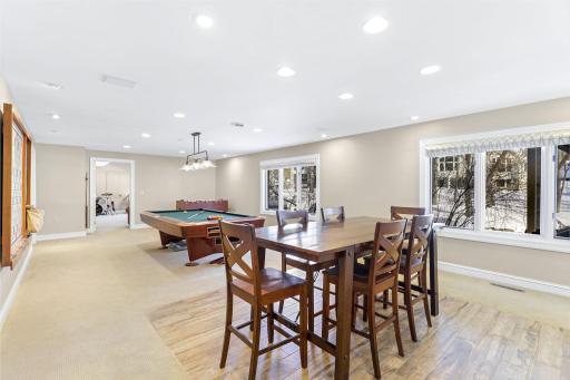 The spacious amusement room is great for entertaining and features a wet bar with a beverage fridge.